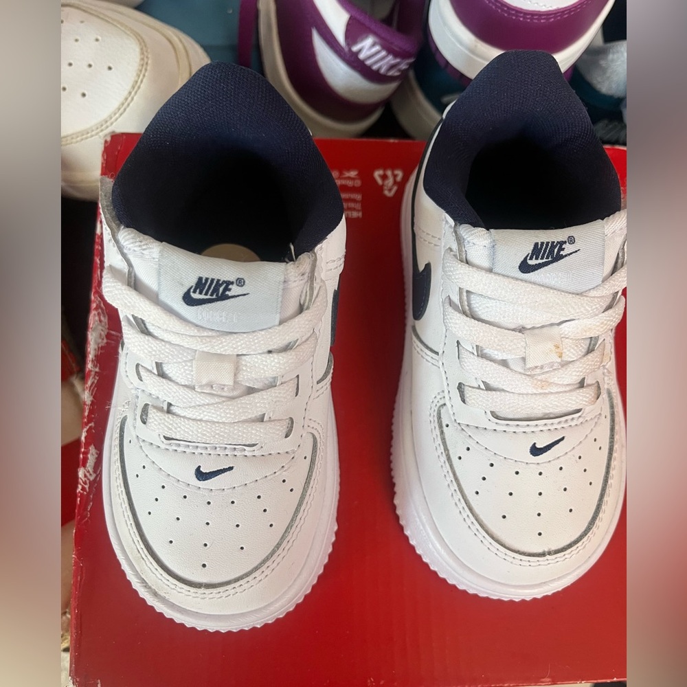 Nike Kids White Sneakers with Navy Accents